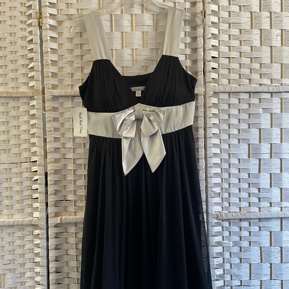 Cute black dolly dress with silver bow in front